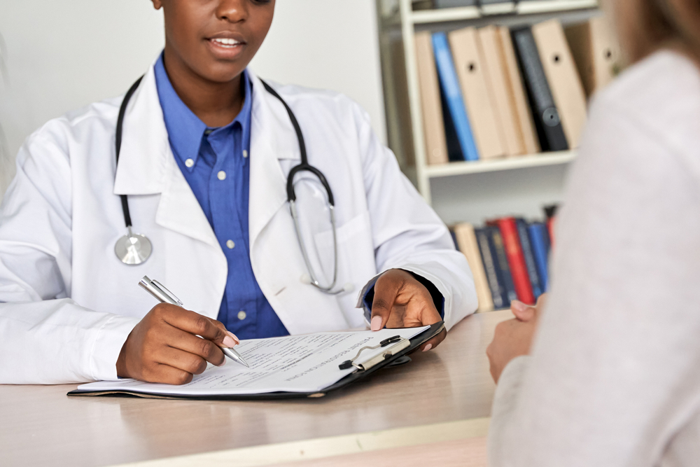 Pregnant Professional at Desk